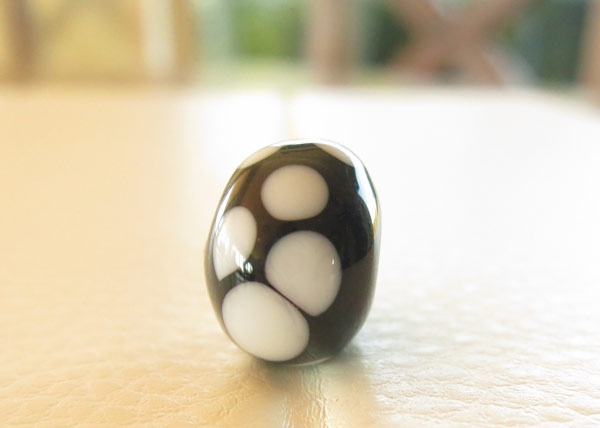 Beginner glass bead made by a teenager